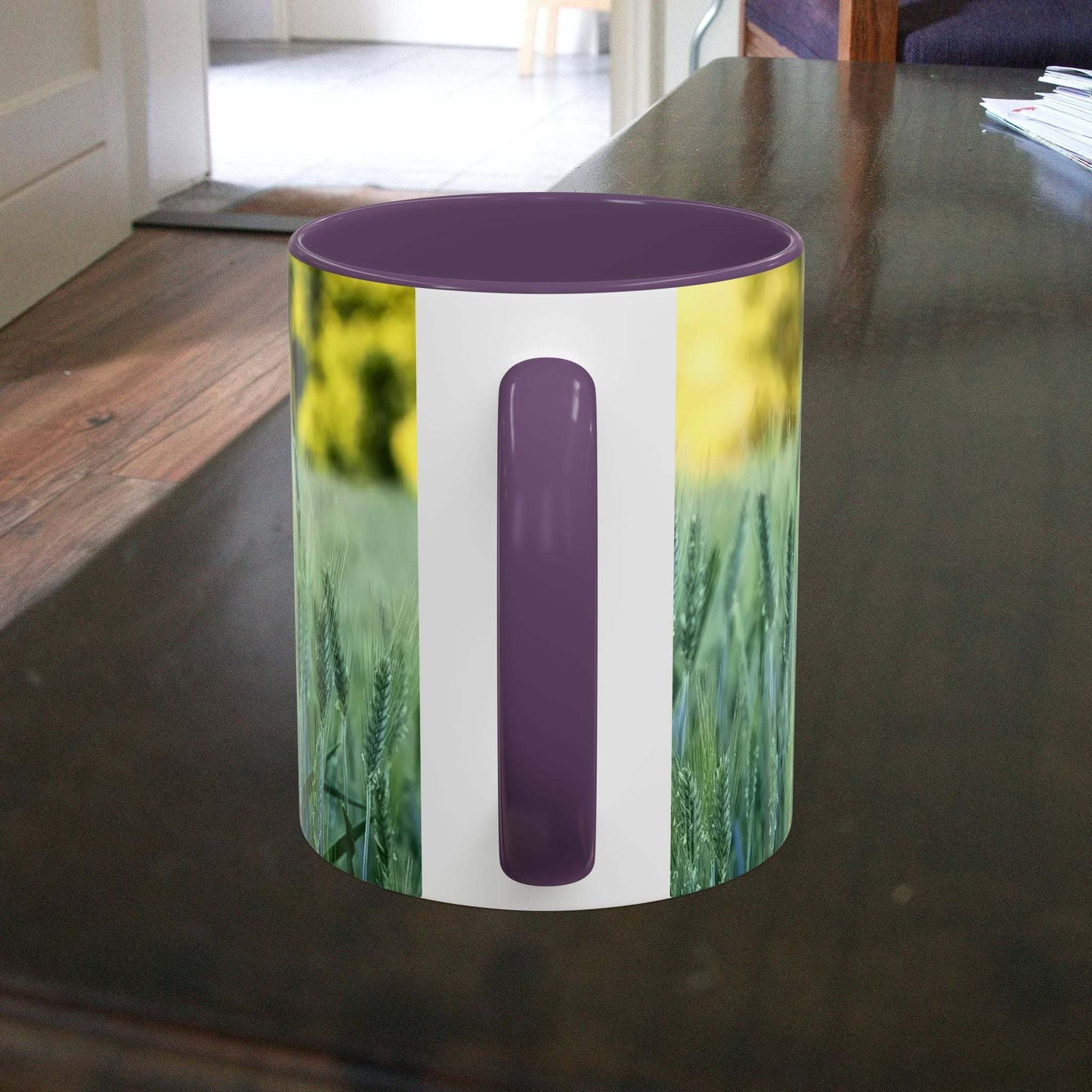 Wheat field design coffee mug on wooden table, nature-inspired gift.