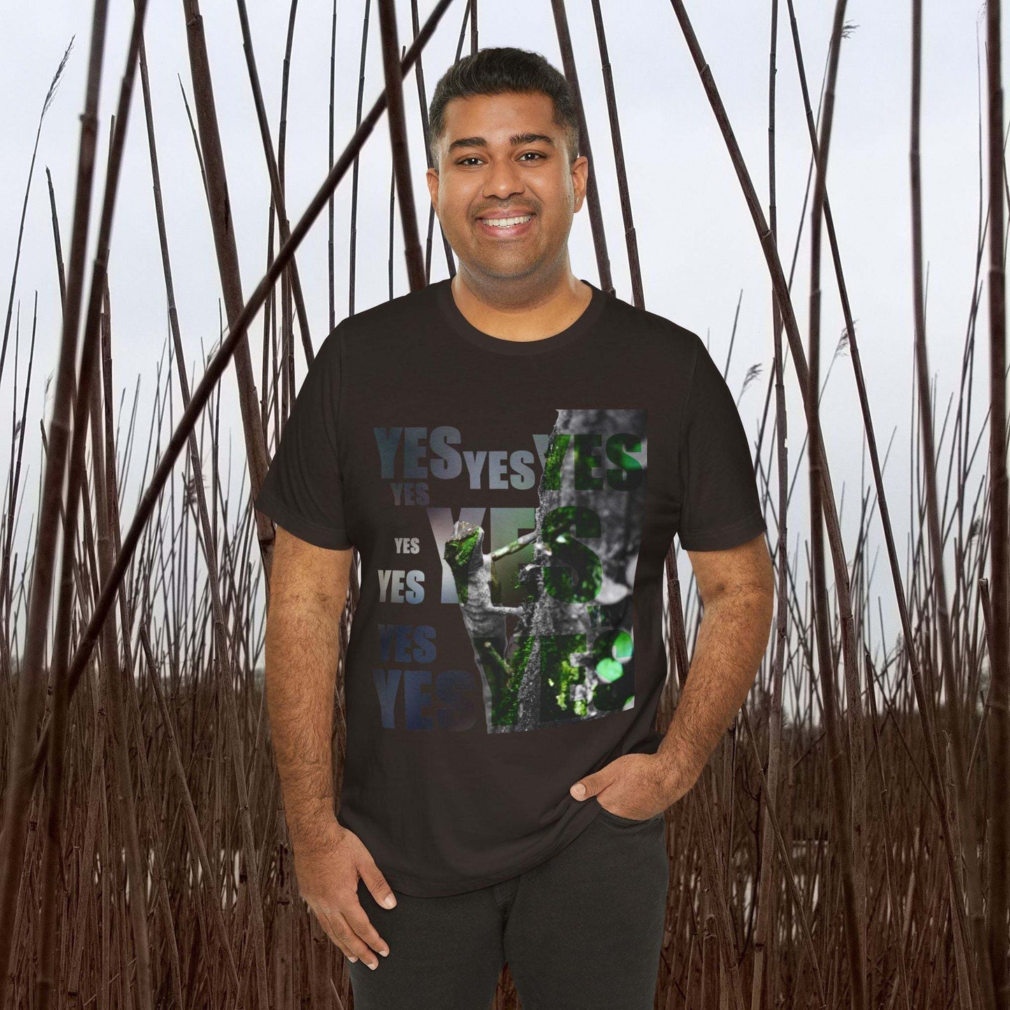Unisex Tee with nature-themed "Yes and No" print, worn by a person in a field setting.