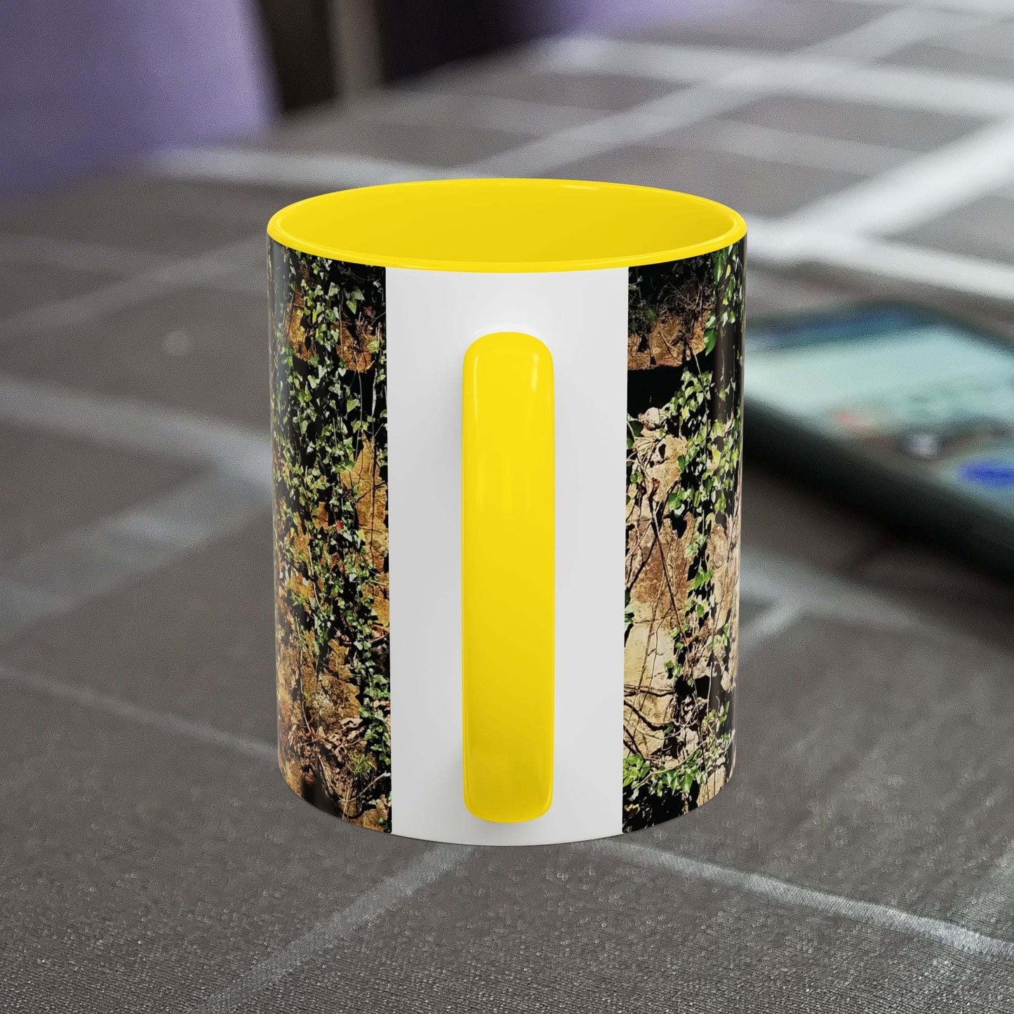 Overgrown Rocks Adventure Mug with nature-inspired design and yellow handle.