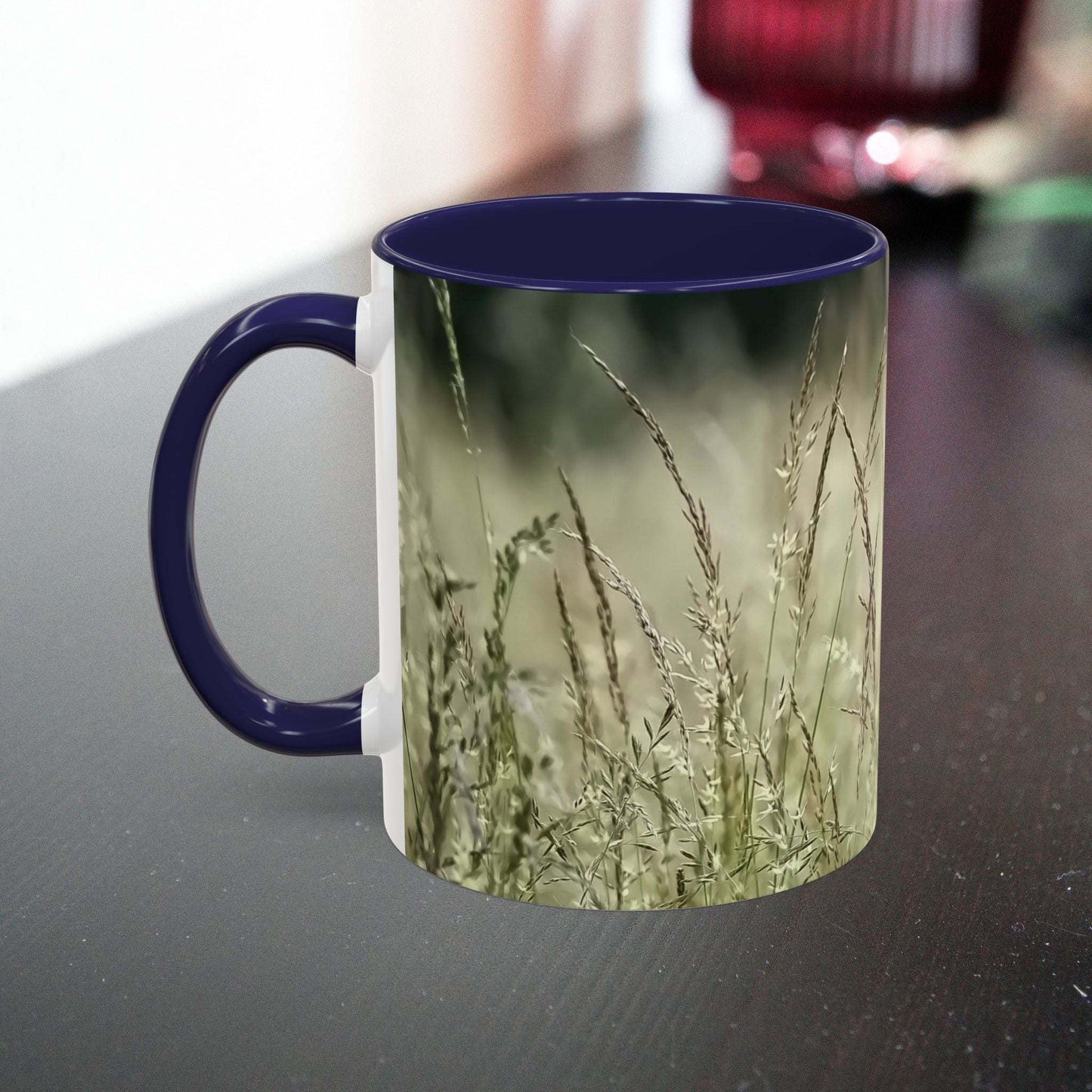Flowering grass mug on table, nature-inspired ceramic design.