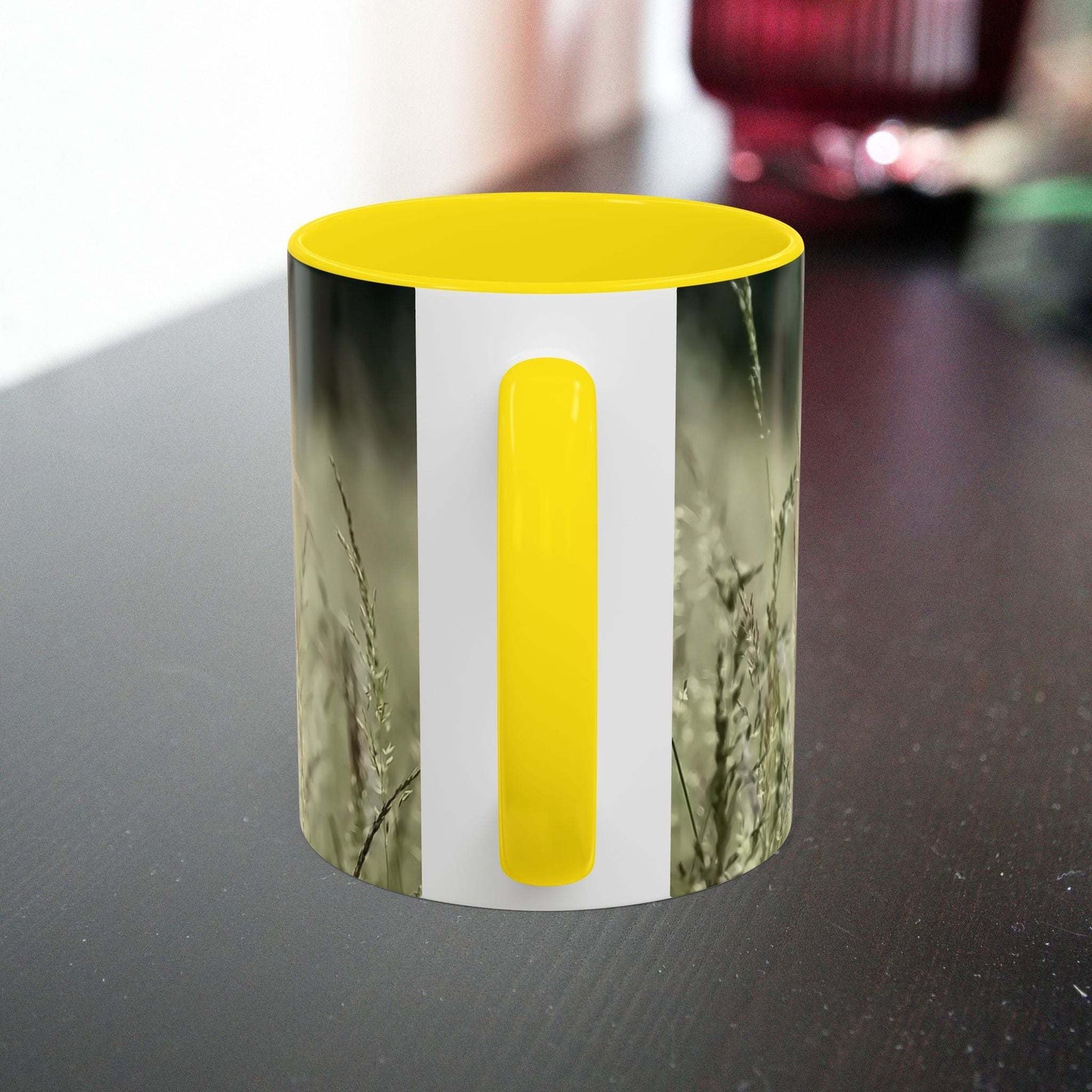 Ceramic mug with flowering grass design and yellow interior, ideal for nature lovers.