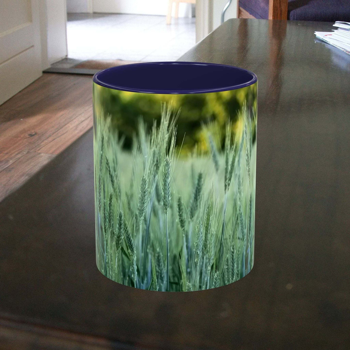 Wheat field design coffee mug on a table.