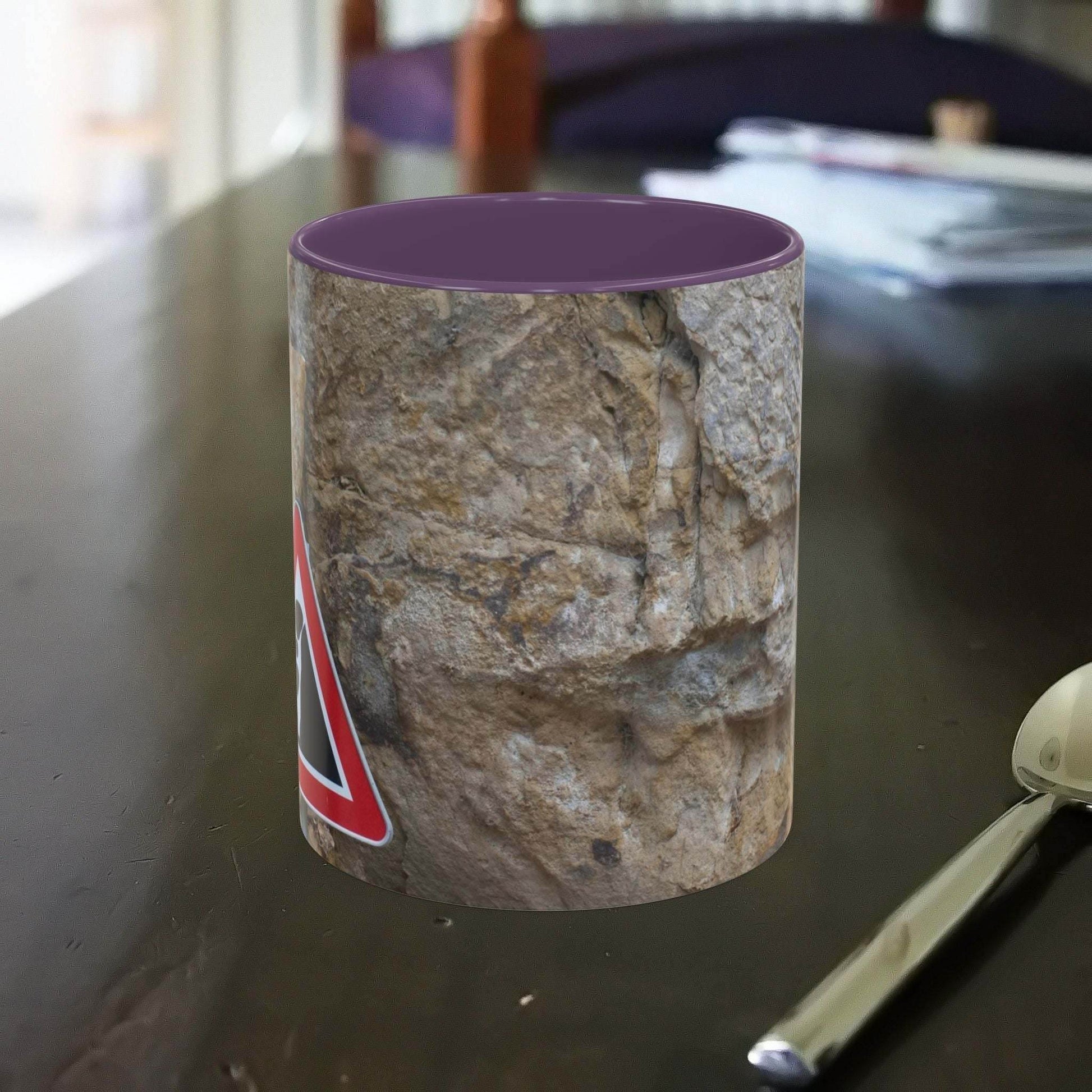 Rocky Mug featuring danger of falling rocks design, perfect for mountain lovers.