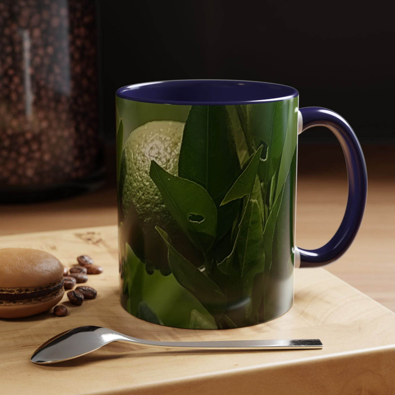 Colorful 11oz Fruit Mug in use, highlighting the dark navy handle and navy inside contrast print.