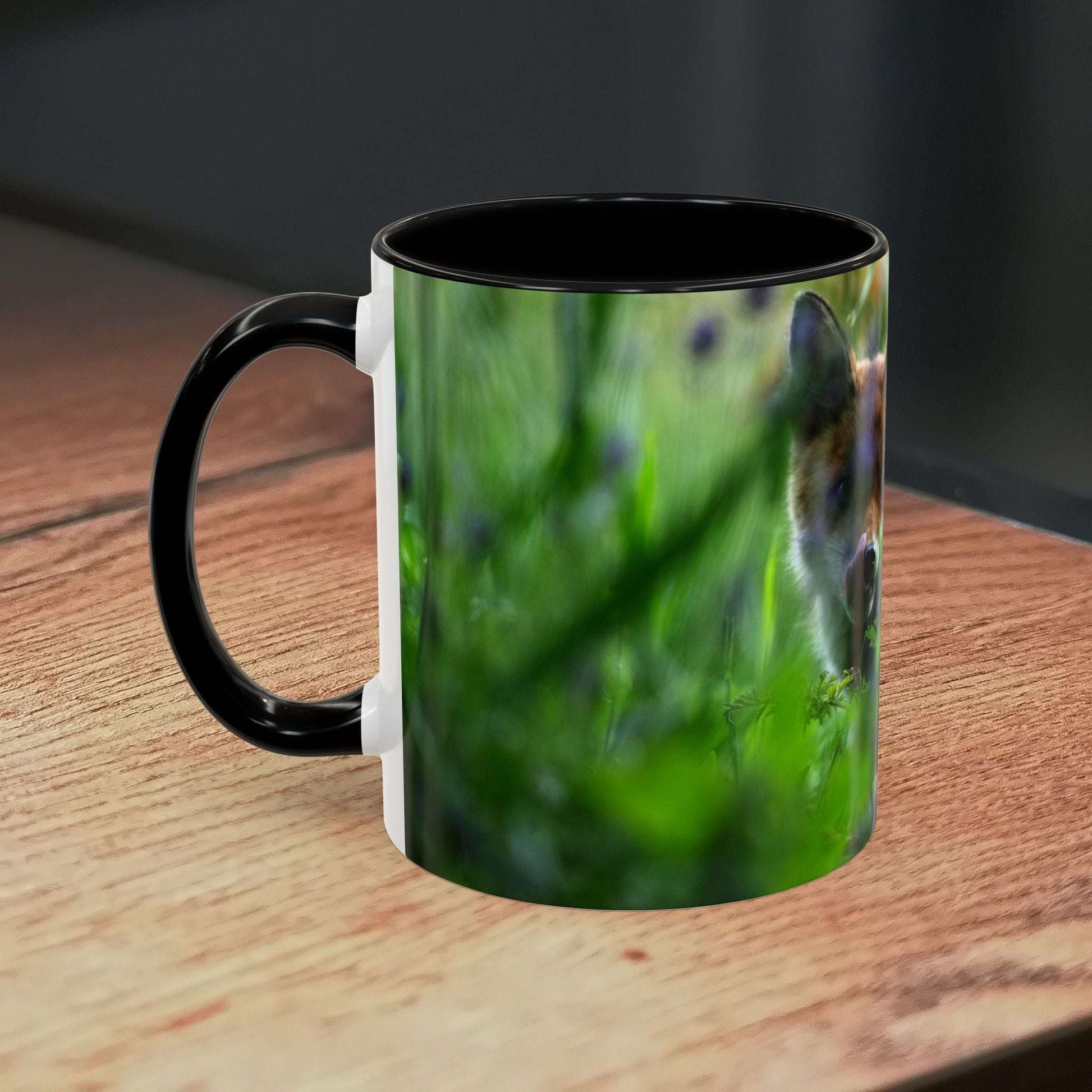 Fox-inspired accent coffee mug with nature design on wooden table.