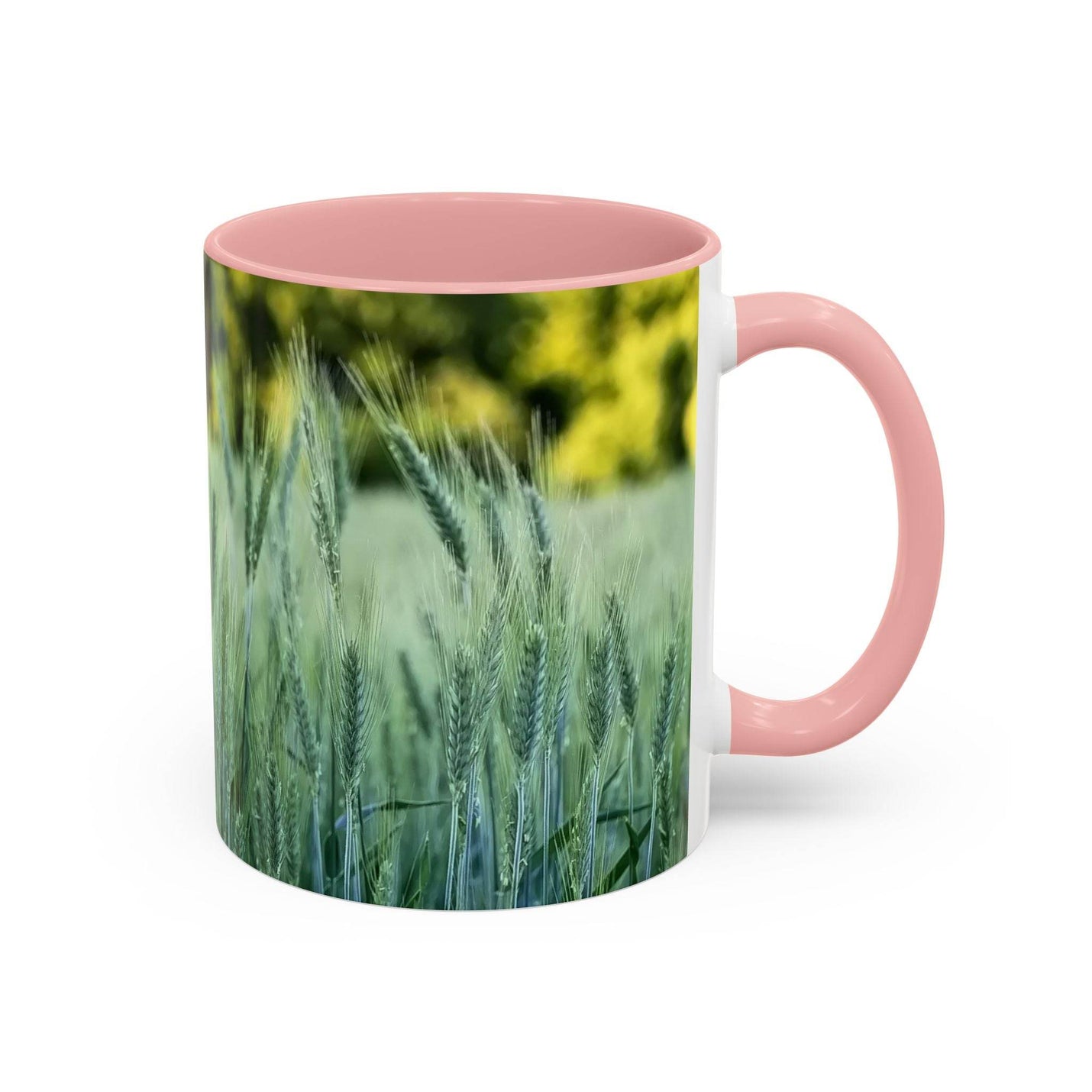 Serene 11oz Mug - Wheat Field Design Coffee Mug showing the pink handle and pink inside beside books.