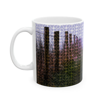 Soulful 11oz ceramic mug featuring a misty forest fence landscape print in soft mauves and forest greens with an organic looping pattern.