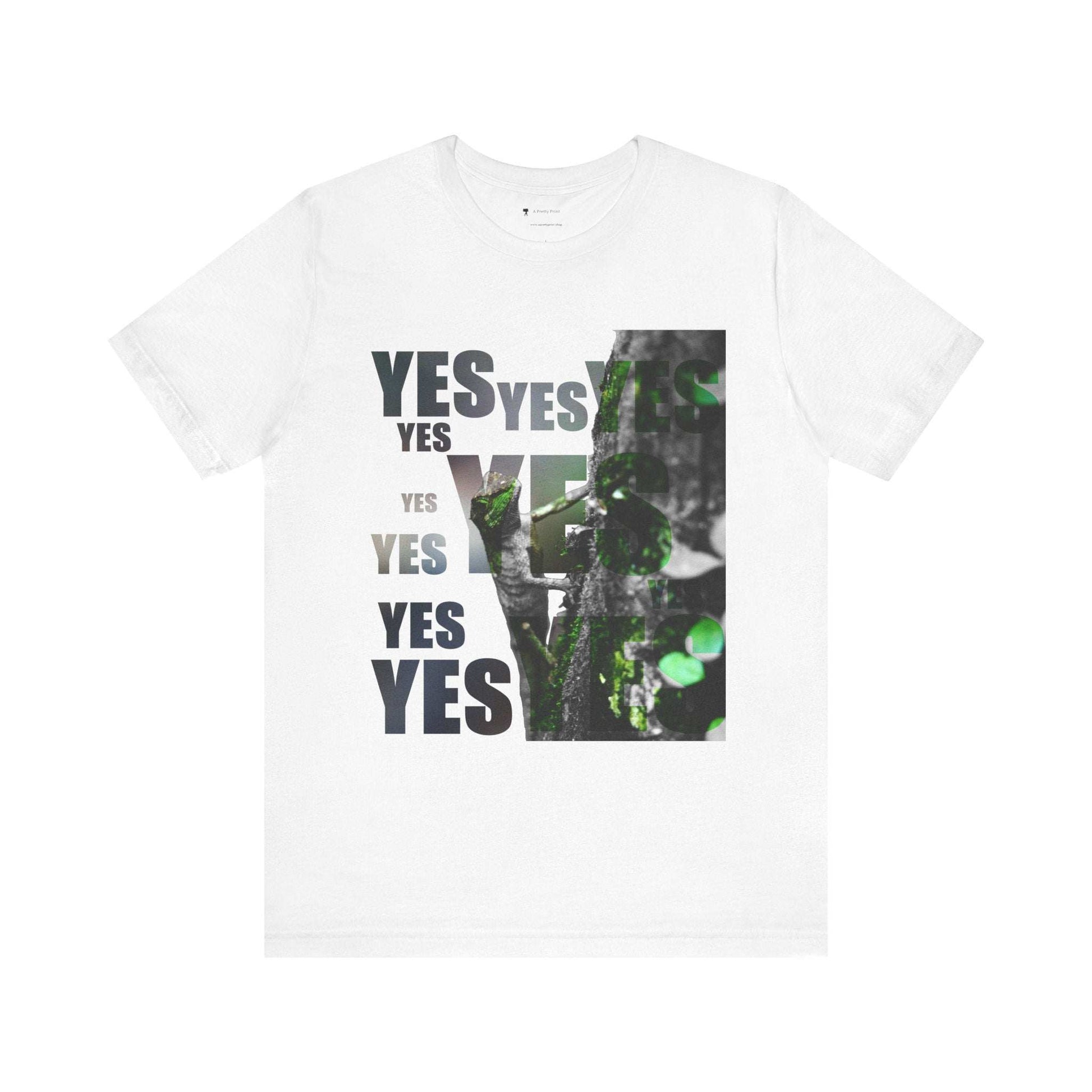 Unisex Tee with "Yes" Graphic and Nature Print Design on White Background.