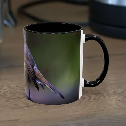 White ceramic 11oz mug featuring a vibrant robin illustration, perfect for birdwatchers and nature lovers.