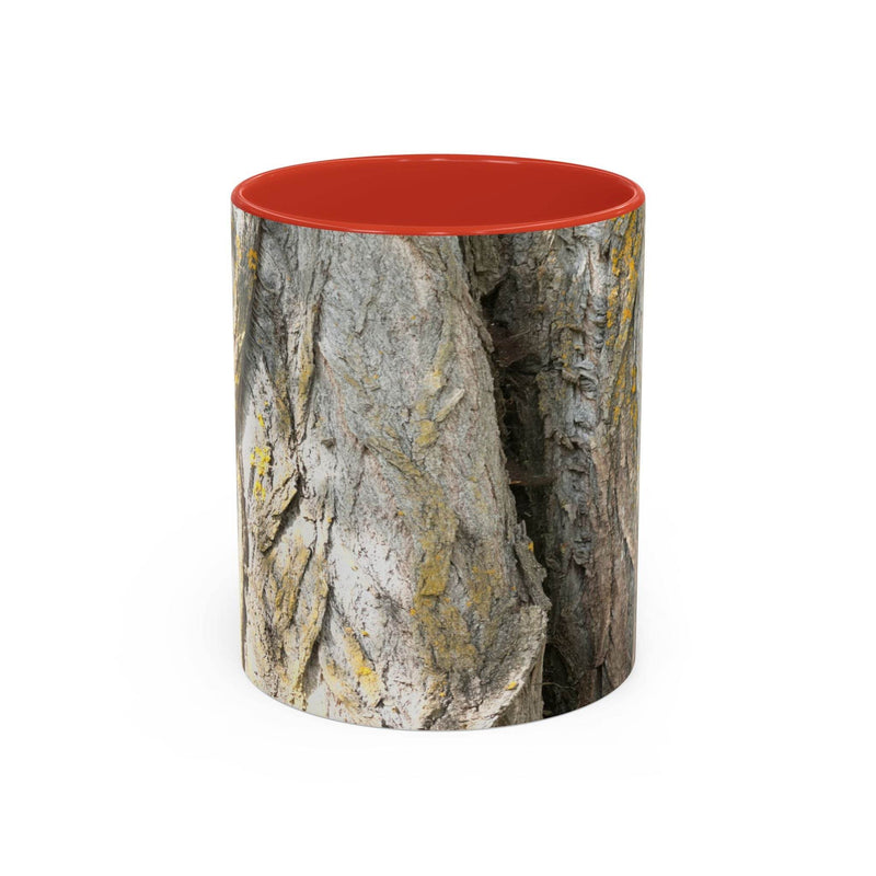 Cozy 11oz Coffee Mug - Tree Trunk Design showing the red handle and red inside near cozy blankets.