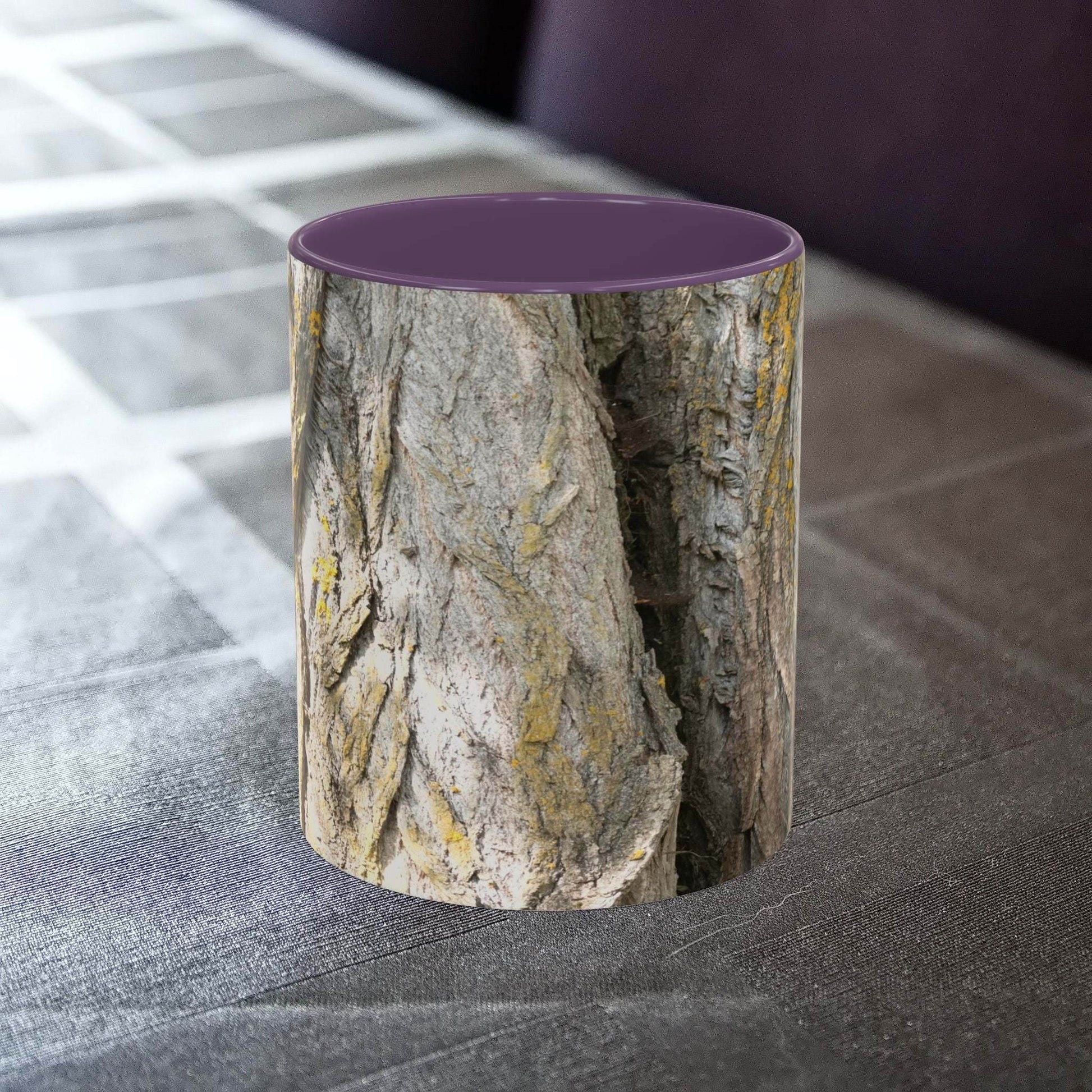 Coffee mug with tree trunk design on a table, ideal for nature lovers.