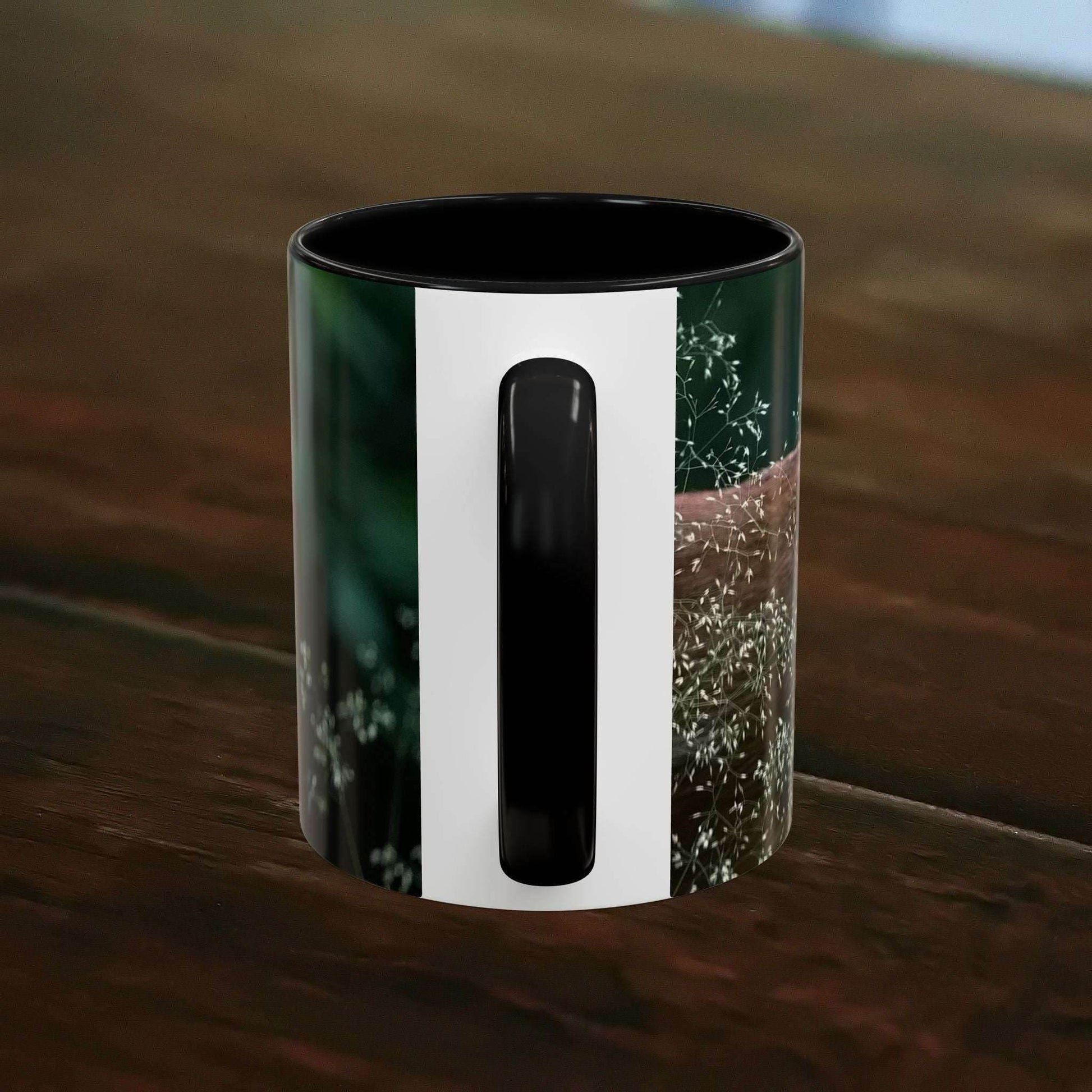 Nature-Inspired Deer Ceramic Mug - 11oz on a wooden table with floral accents.