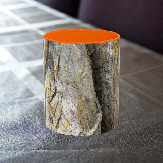 Rustic tree trunk design coffee mug on a table.