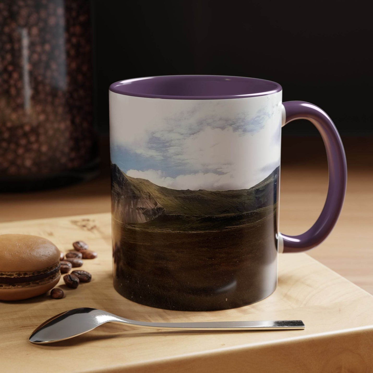 Nordic design 11oz Coffee Mug - Iceland Scenery on a stand, showing its purple handle and purple inside.