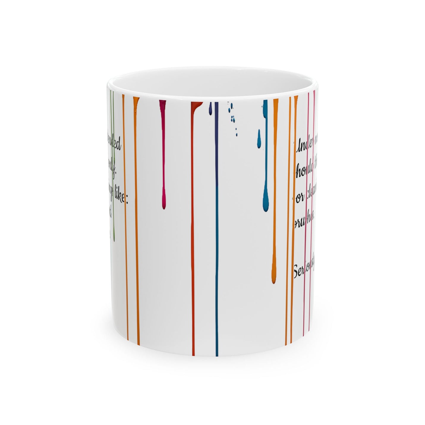 Glossy 11oz Paint Drips Mug, Ceramic Coffee Cup near a bright room window during a relaxing studio break.