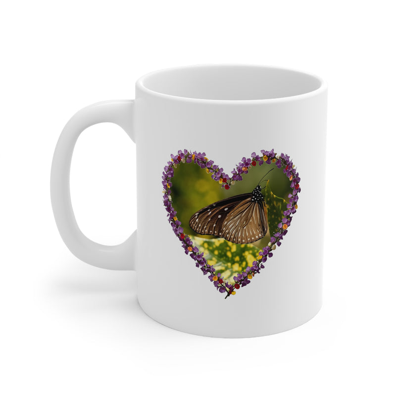 Premium 325ml butterfly heart mug with a delicate purple floral heart frame on a glossy white ceramic surface.
