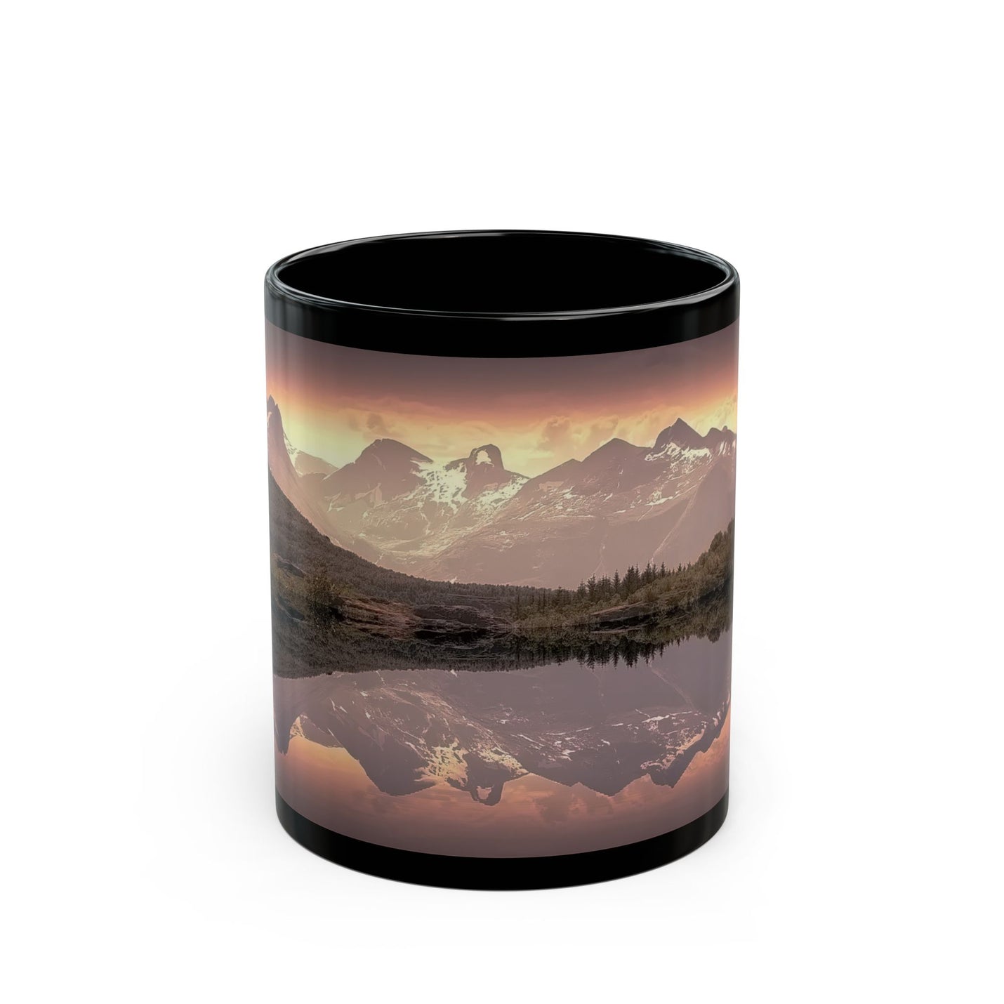 Glossy black 11oz Mountain Reflection Black Mug — Scenic Sunset Lake Coffee Mug next to green botanical plants.