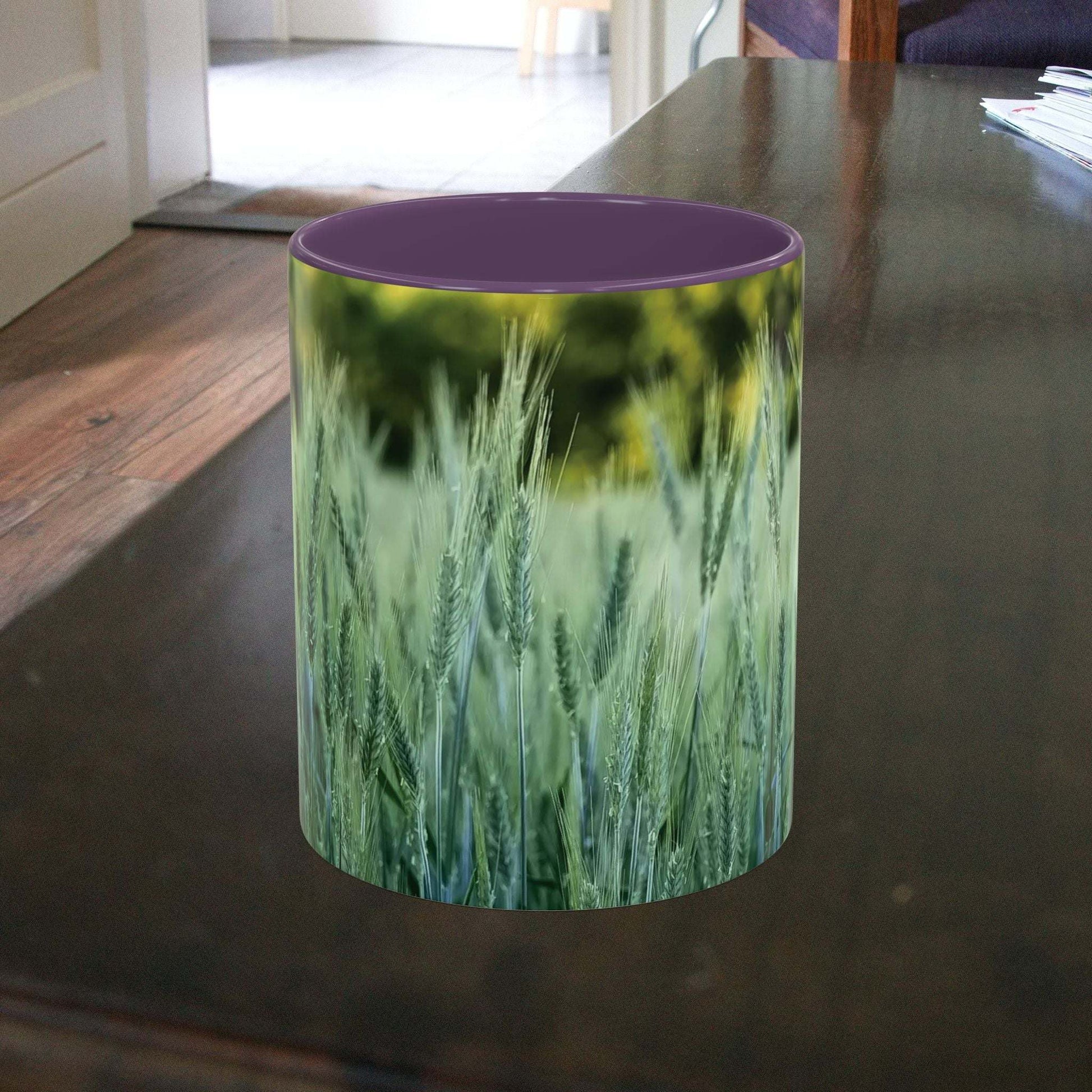 Wheat field design coffee mug on wooden table.