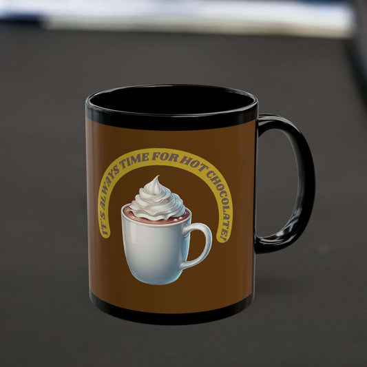 Black ceramic mug with "It's always time for hot chocolate" design, ideal for cozy moments.