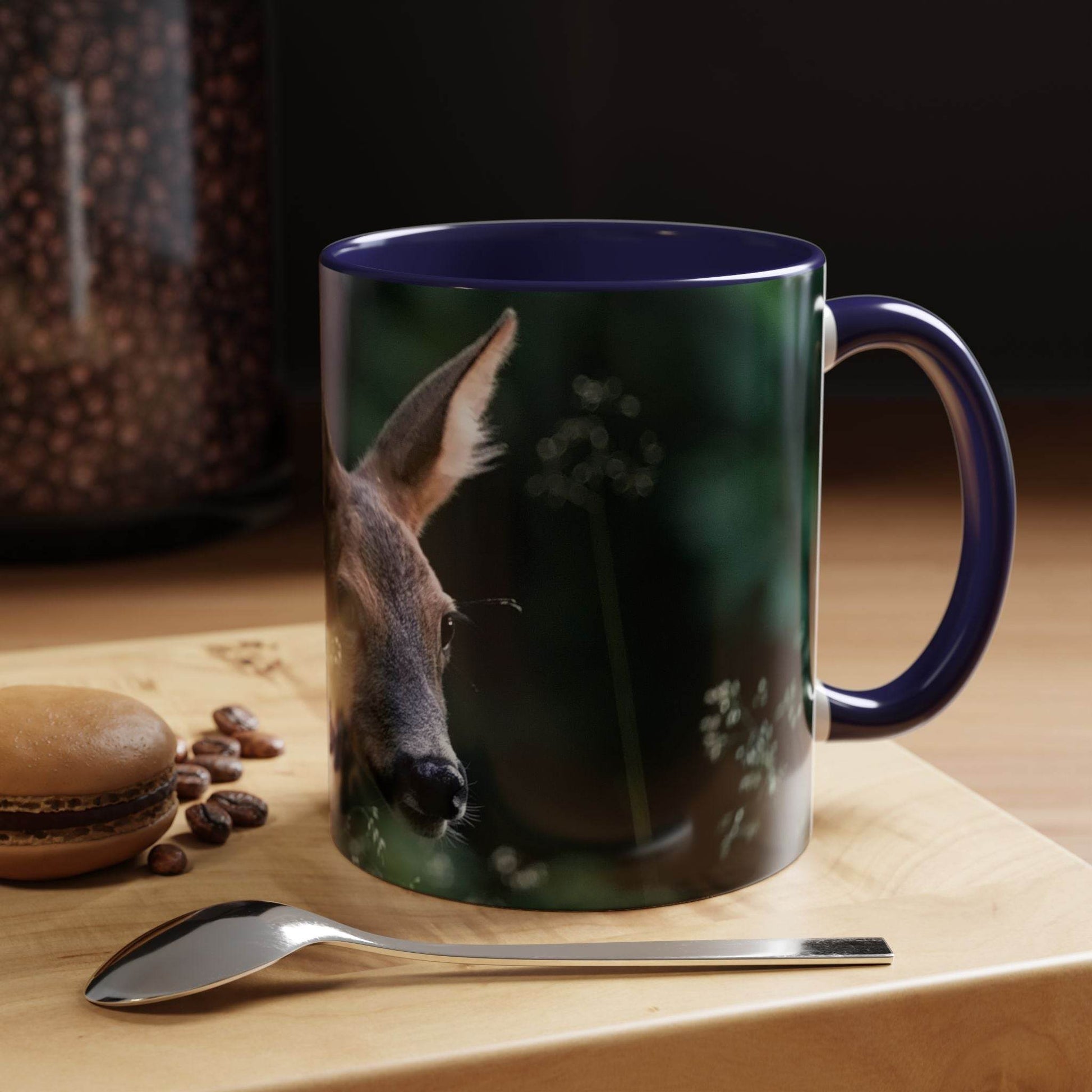 Nature-Inspired Deer Ceramic Mug - 11oz with deer and floral design on a wooden table.
