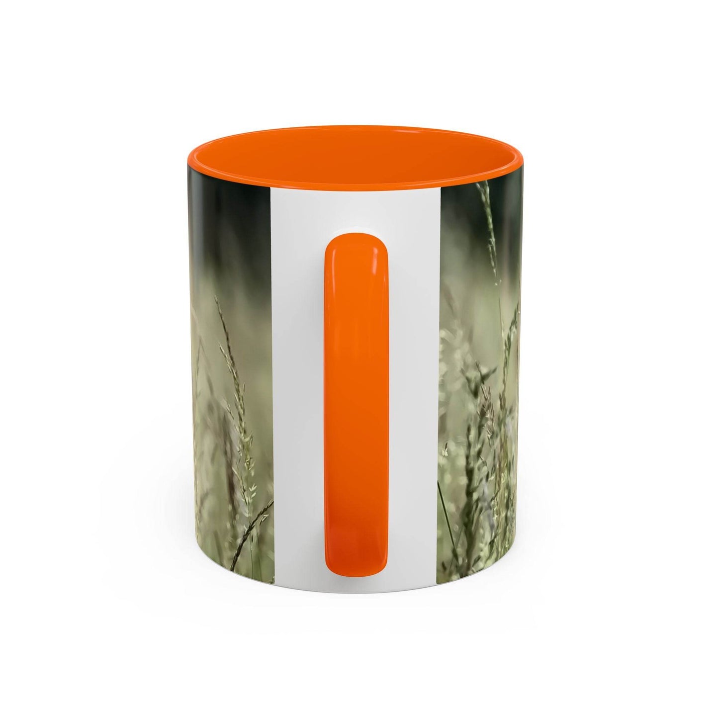 Premium 11oz Mug, Flowering Grass - Bring Nature Inside on a board, featuring an orange handle and inside.