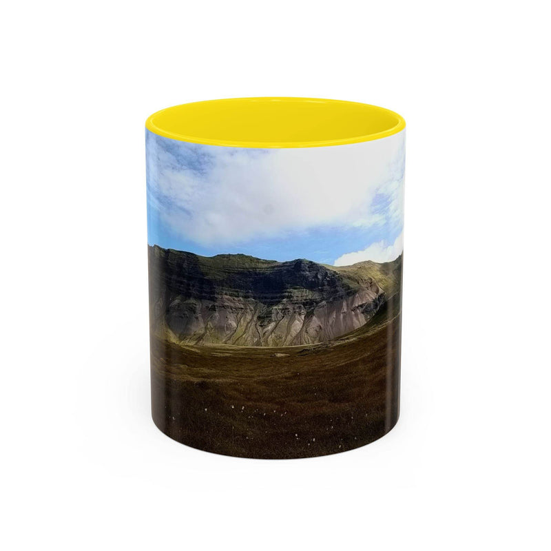 11oz ceramic Coffee Mug - Iceland Scenery with a yellow handle and yellow inside on a coffee table.
