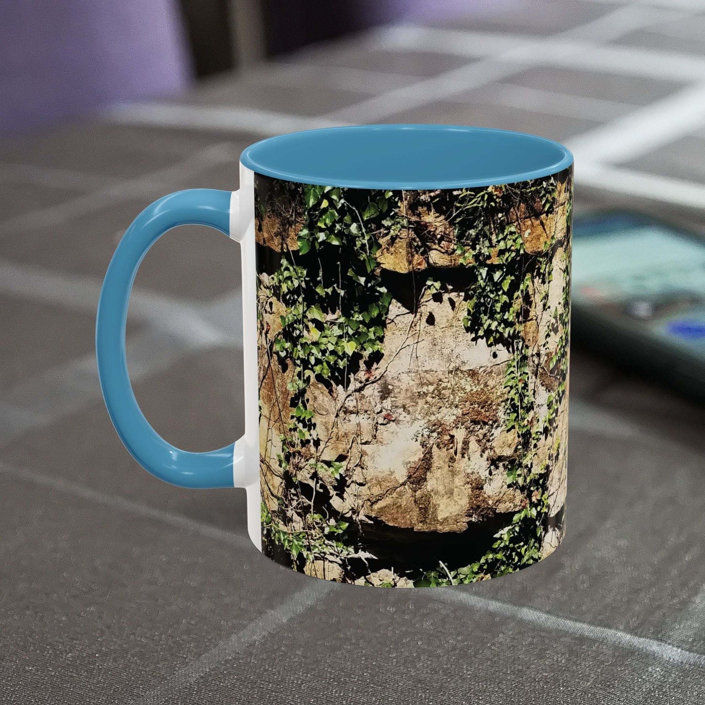 Overgrown rocks adventure mug with nature-inspired design on table.