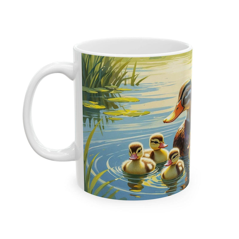 Charming 11oz ceramic coffee mug featuring a swimming mother duck with adorable little ducklings.