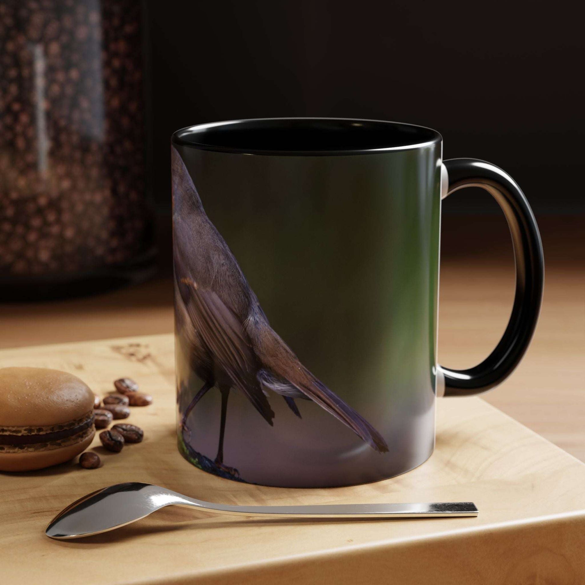 White ceramic 11oz mug with robin illustration, perfect for birdwatchers and nature lovers.