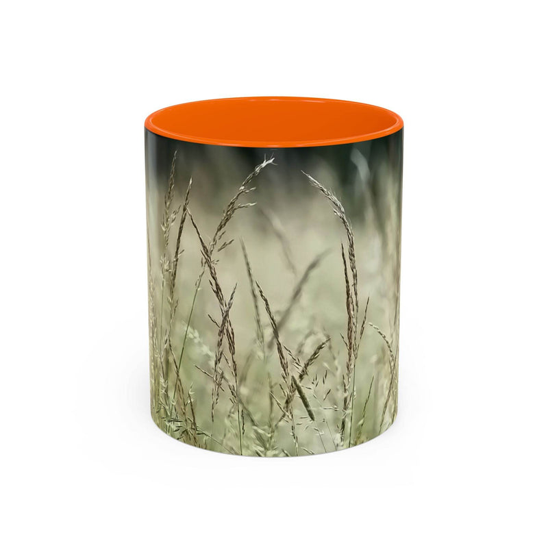 Detailed 11oz Mug, Flowering Grass - Bring Nature Inside showing the orange handle and orange inside near wood.