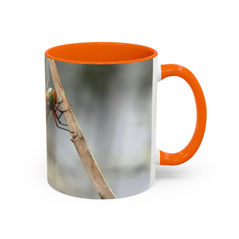 High-quality 325ml ceramic mug featuring a dragonfly illustration with an eye-catching contrast orange handle and interior.