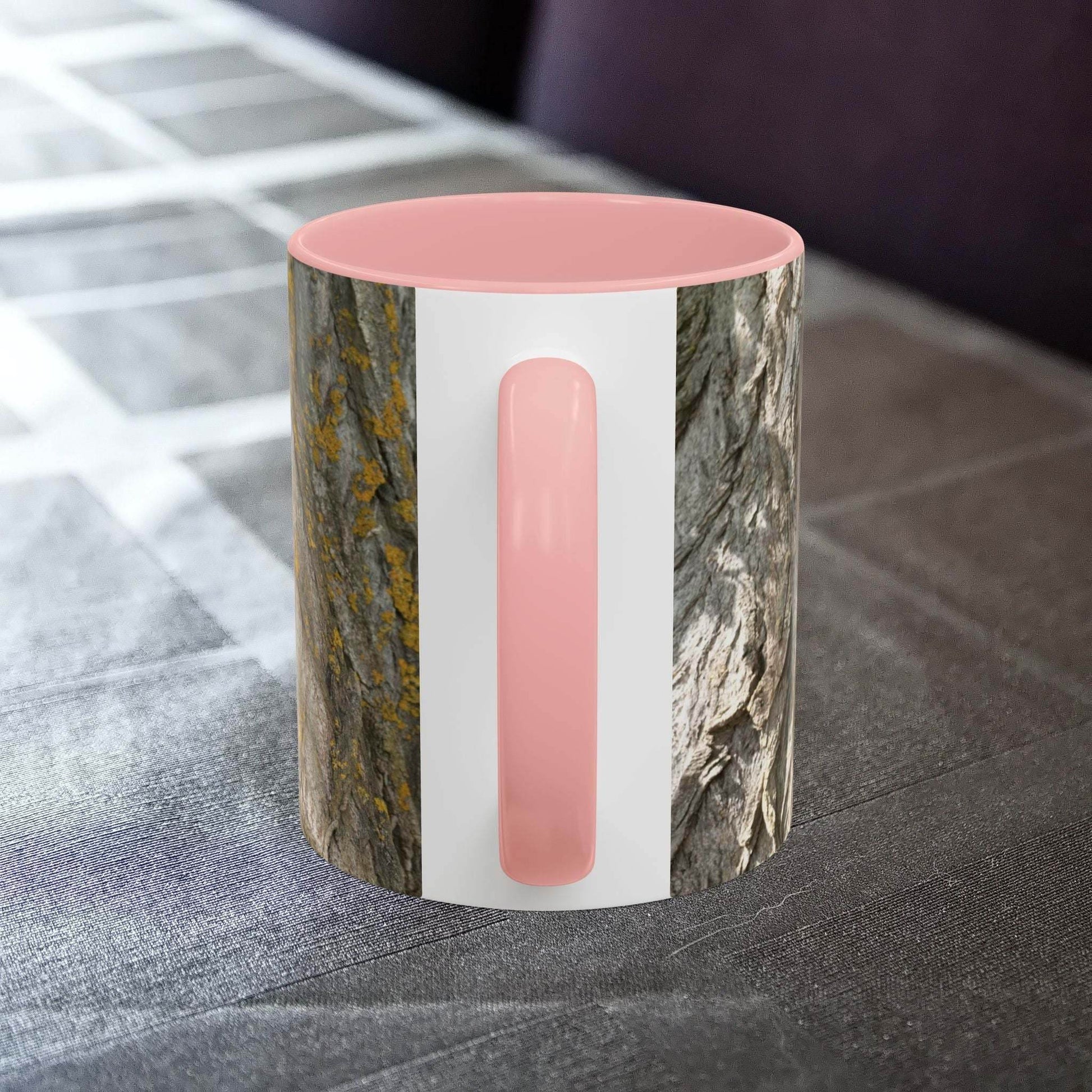 Coffee mug with tree trunk design on a table, offering a rustic and cozy vibe.