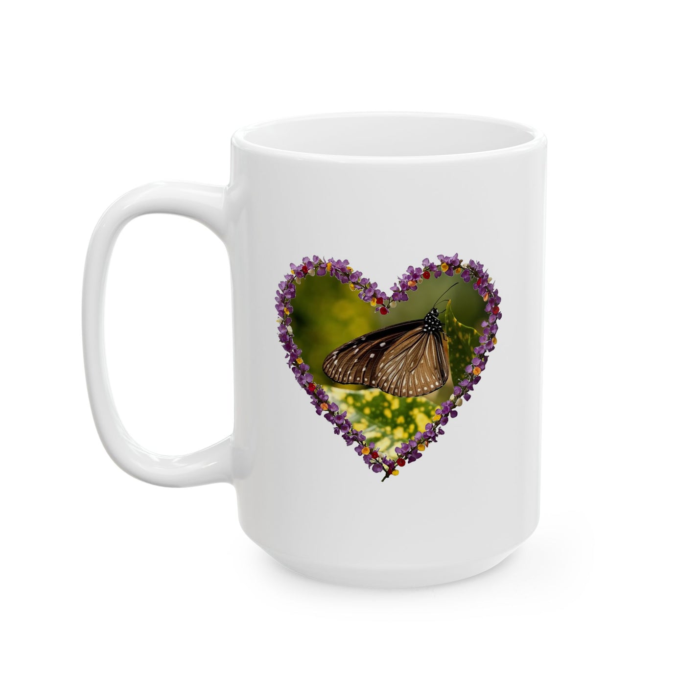 Charming 15oz ceramic coffee mug featuring a delicate heart-shaped wreath of tiny purple blooms framing a resting butterfly.