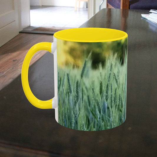 Wheat field design coffee mug on a wooden table.