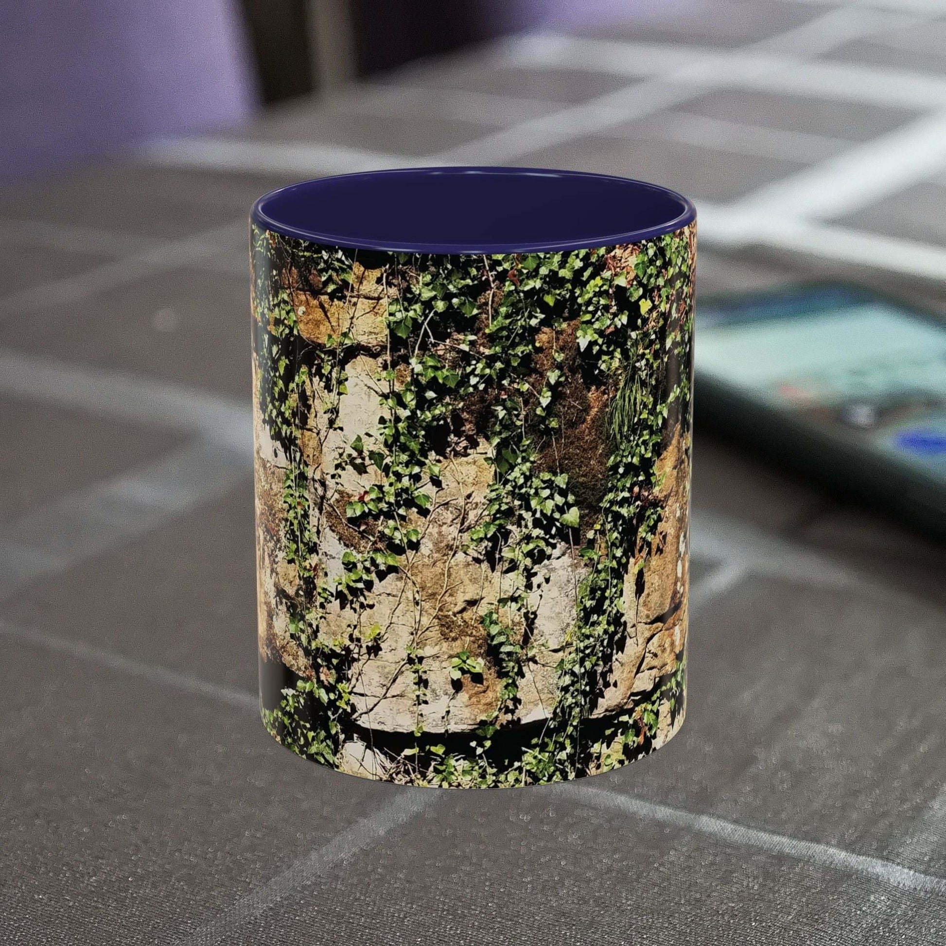 Overgrown Rocks Adventure Mug with outdoor design on table