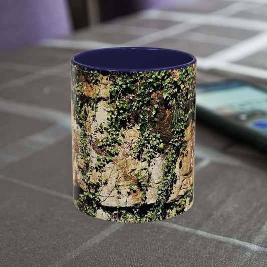 Overgrown Rocks Adventure Mug with outdoor design on table