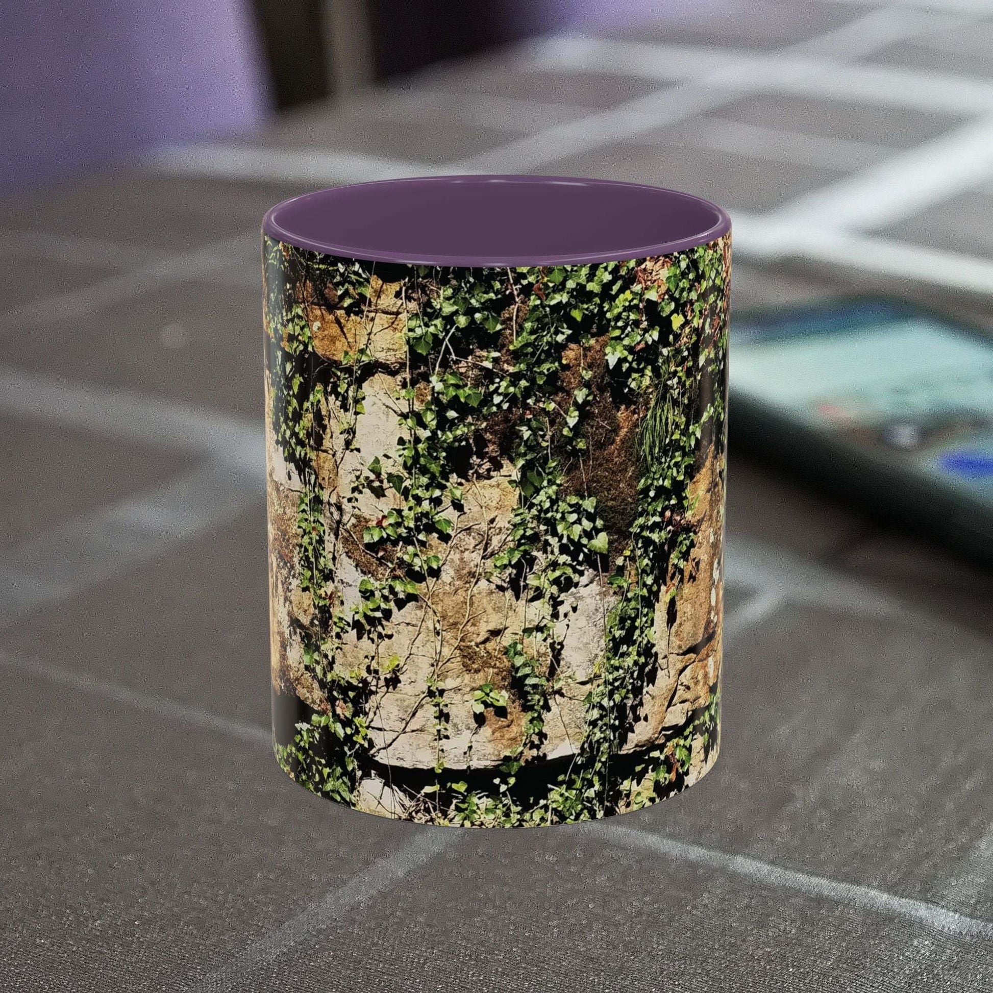 Overgrown rocks adventure mug with nature-inspired design on tabletop.