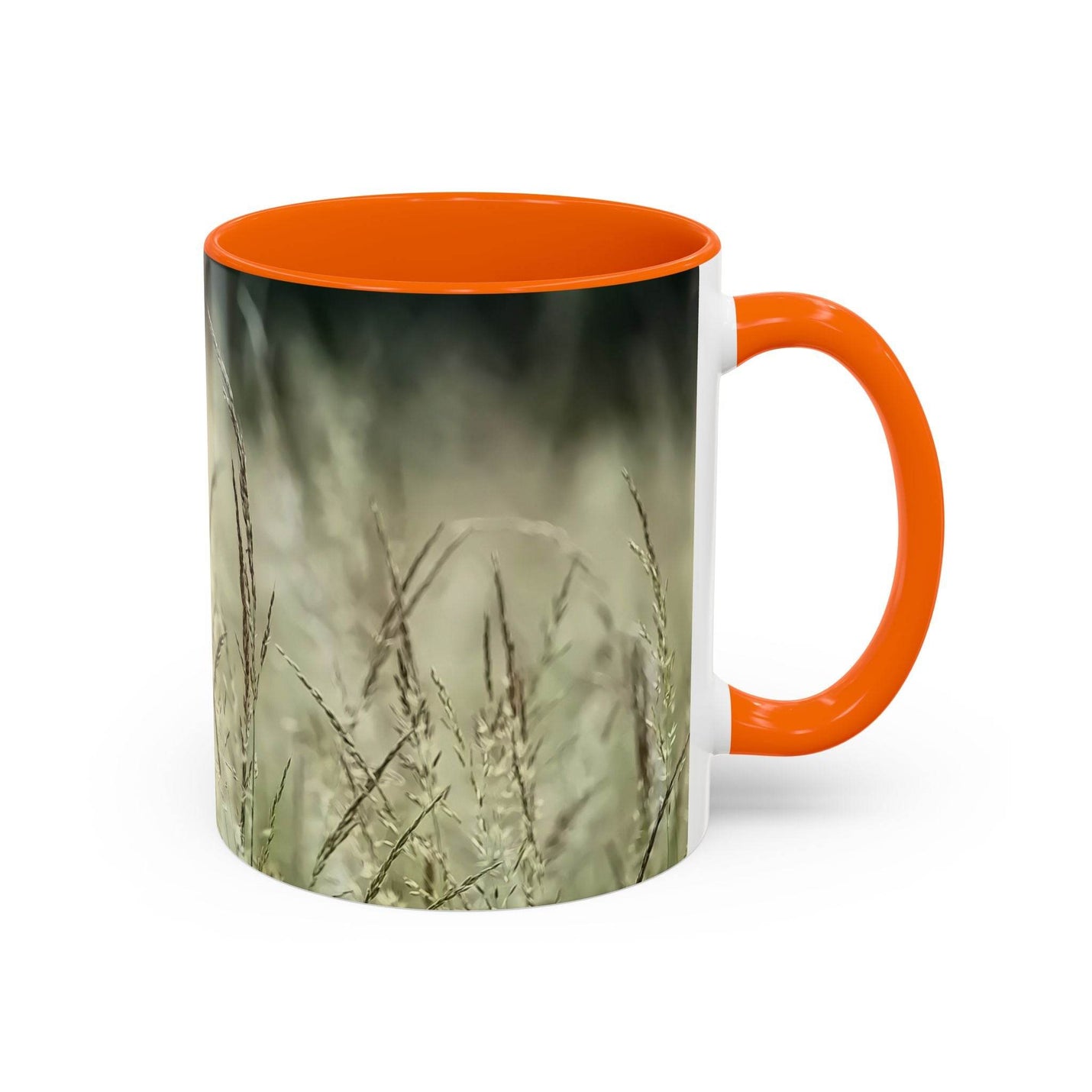 Cozy lifestyle view of 11oz Mug, Flowering Grass - Bring Nature Inside styled with an orange handle and inside.