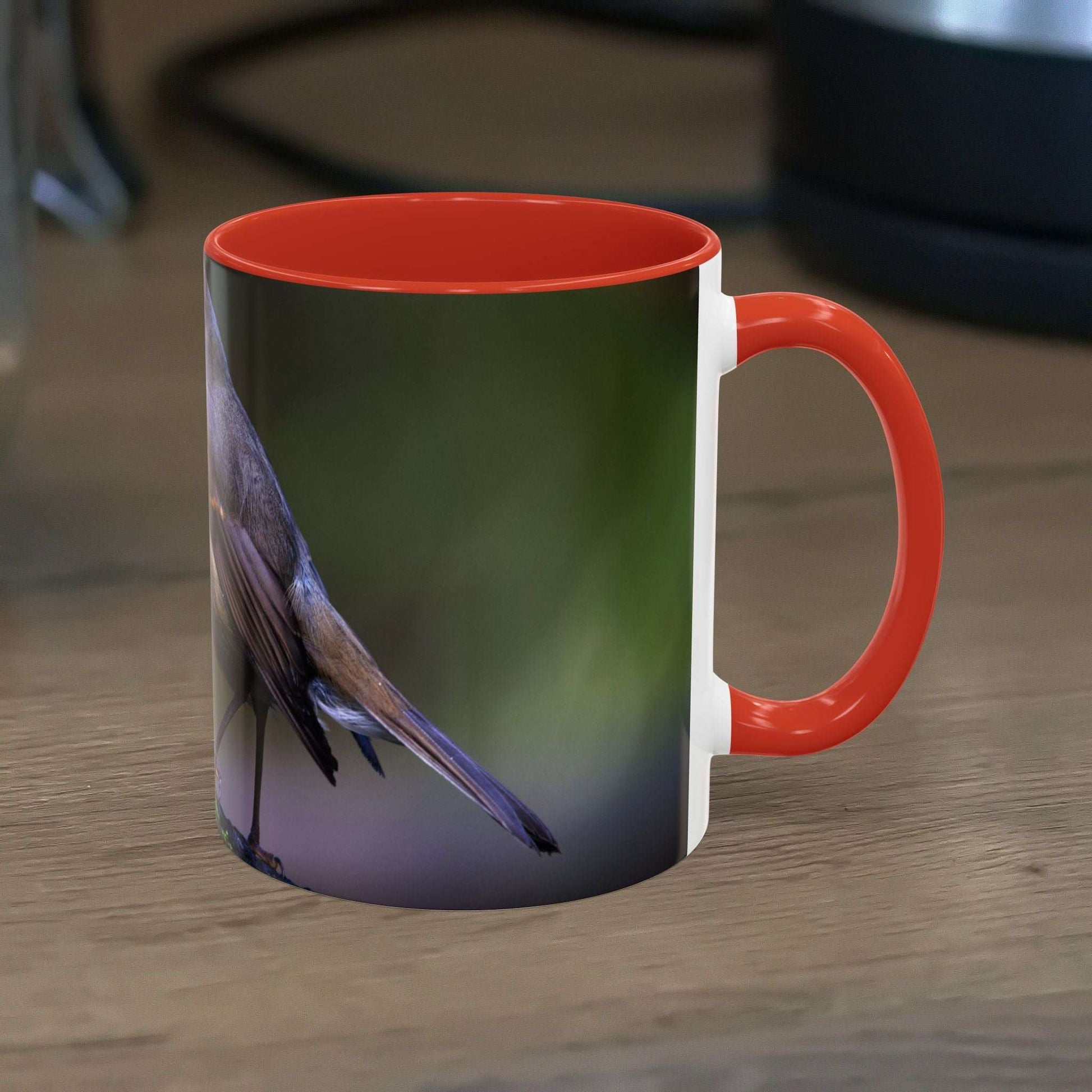 White ceramic 11oz Robin Mug with vibrant bird illustration, perfect for nature lovers.