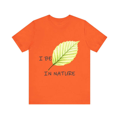 Unisex orange tee with "I Be-Leaf In Nature" design, eco-friendly fashion for nature lovers.