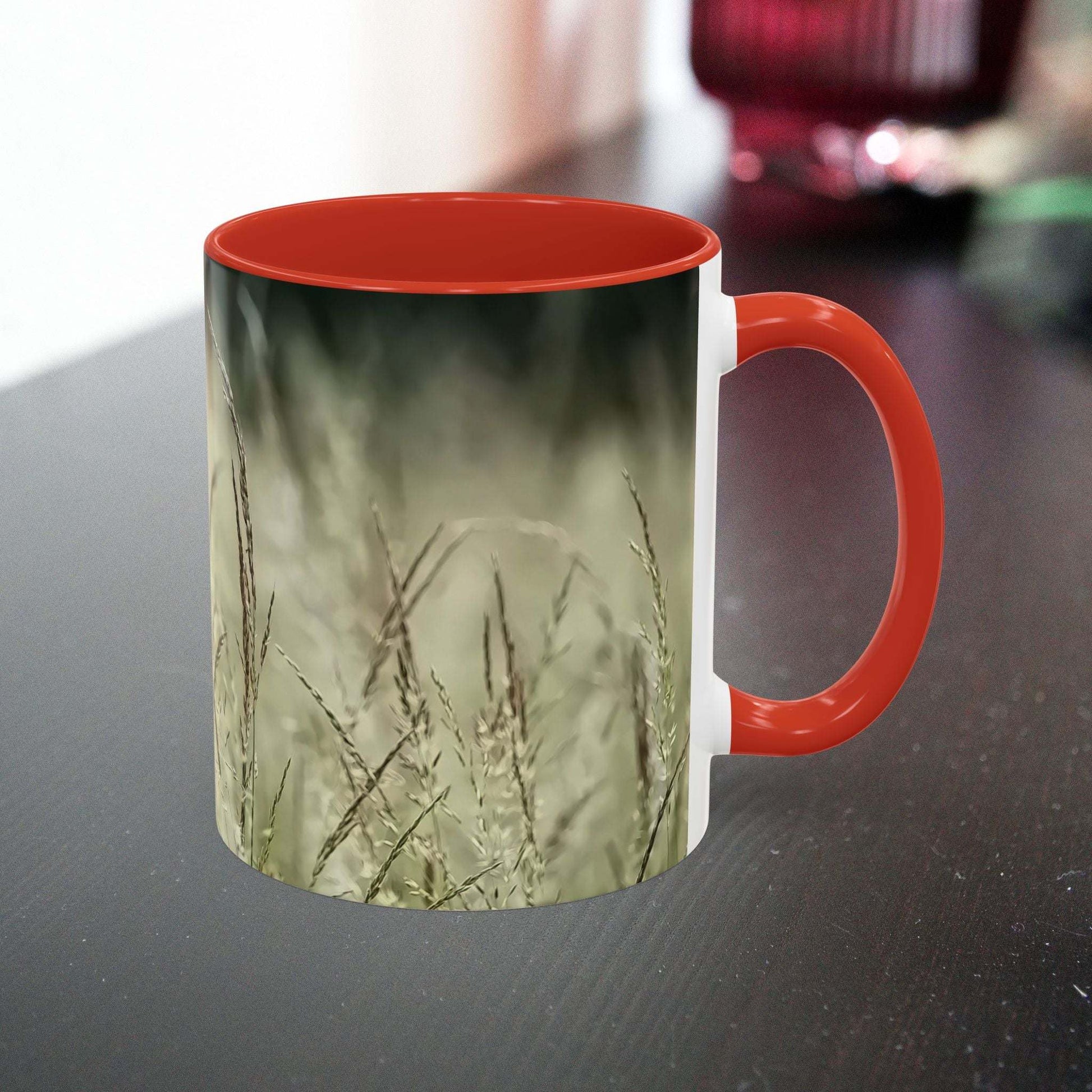 Ceramic mug with flowering grass design, red interior, perfect for nature lovers.