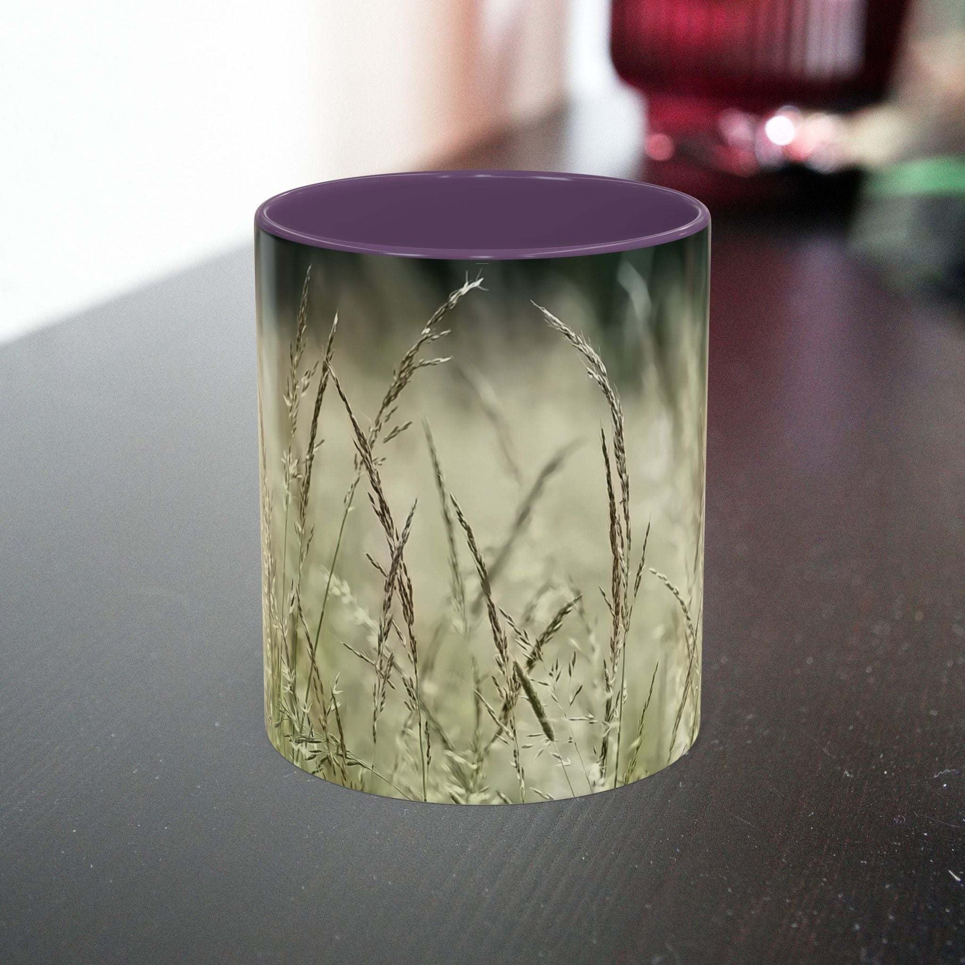 Flowering Grass Mug with natural ceramic design on table.