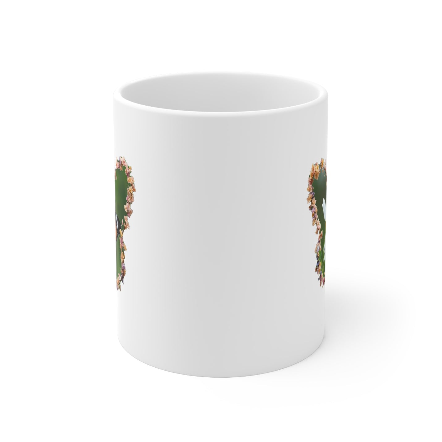 Durable 325ml ceramic mug featuring a nature-inspired butterfly daisy wreath artwork and a comfortable C-handle.