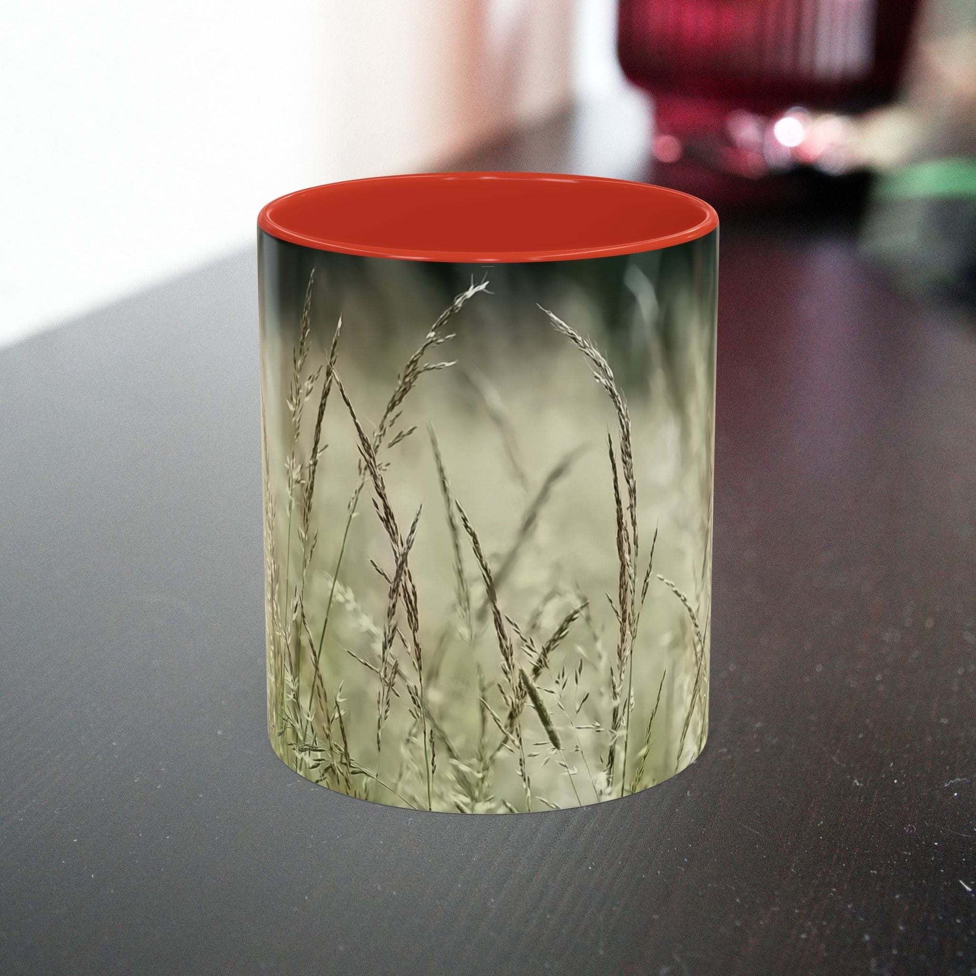 Ceramic mug with flowering grass design, perfect for nature lovers.