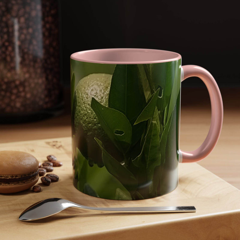 Colorful 11oz Fruit Mug held gently, showcasing the vibrant pink handle and pink inside artistic style.