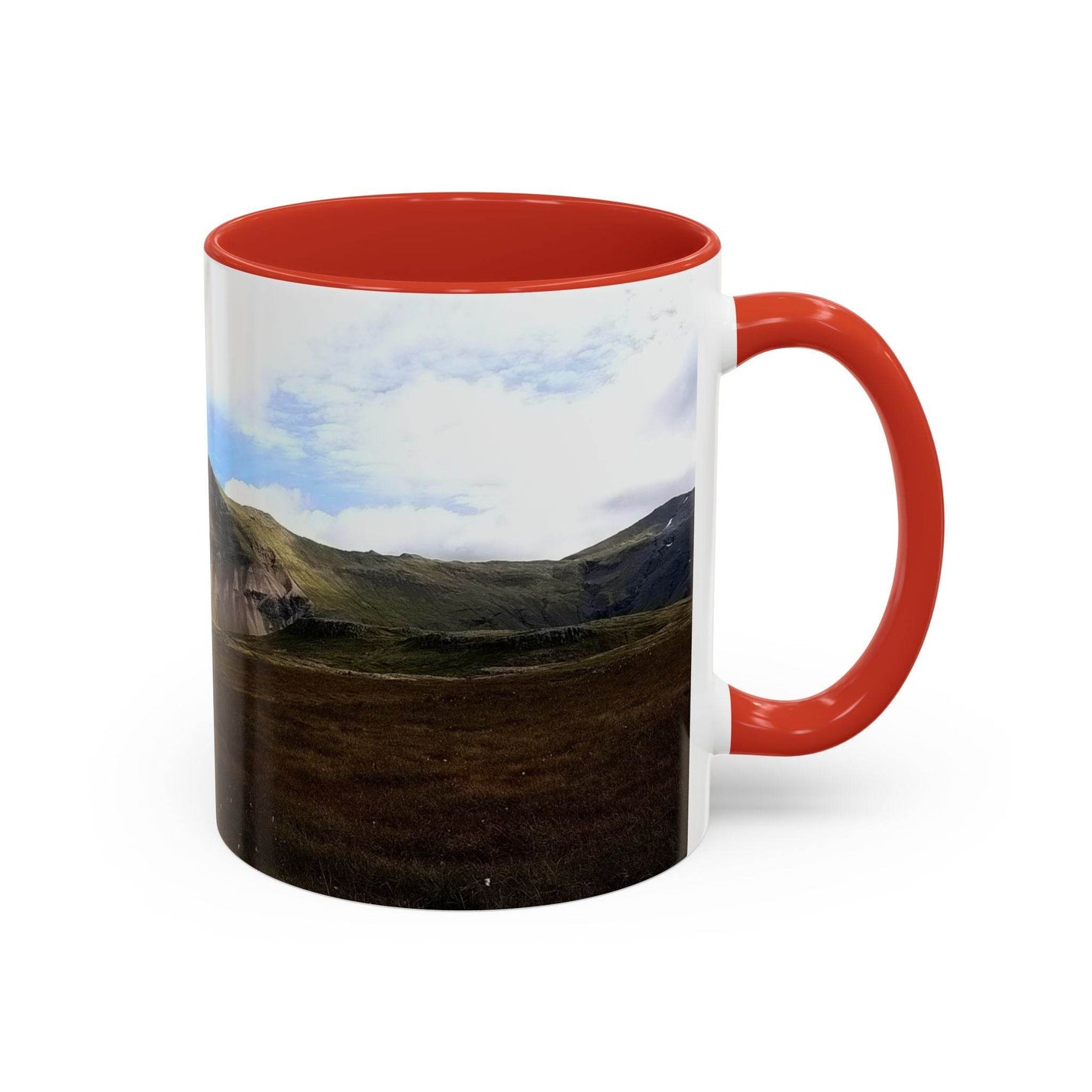 Premium 11oz nature Coffee Mug - Iceland Scenery showing the red handle and red inside near cozy textiles.