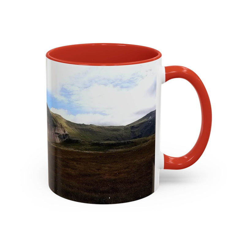 Premium 11oz nature Coffee Mug - Iceland Scenery showing the red handle and red inside near cozy textiles.