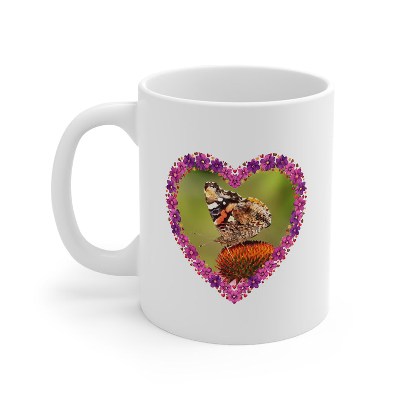 Glossy white 325ml ceramic mug featuring a delicate heart flower frame with a detailed butterfly perched on a coneflower.