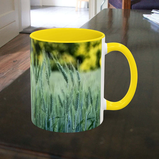 Wheat field design coffee mug on a wooden table.
