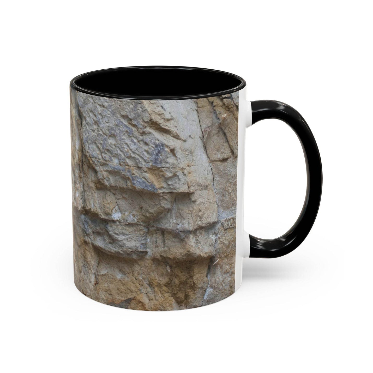 Premium 11oz Rocky Mug, Mountain Lovers, Danger of Falling Rocks on a desk, featuring a black handle and black inside.